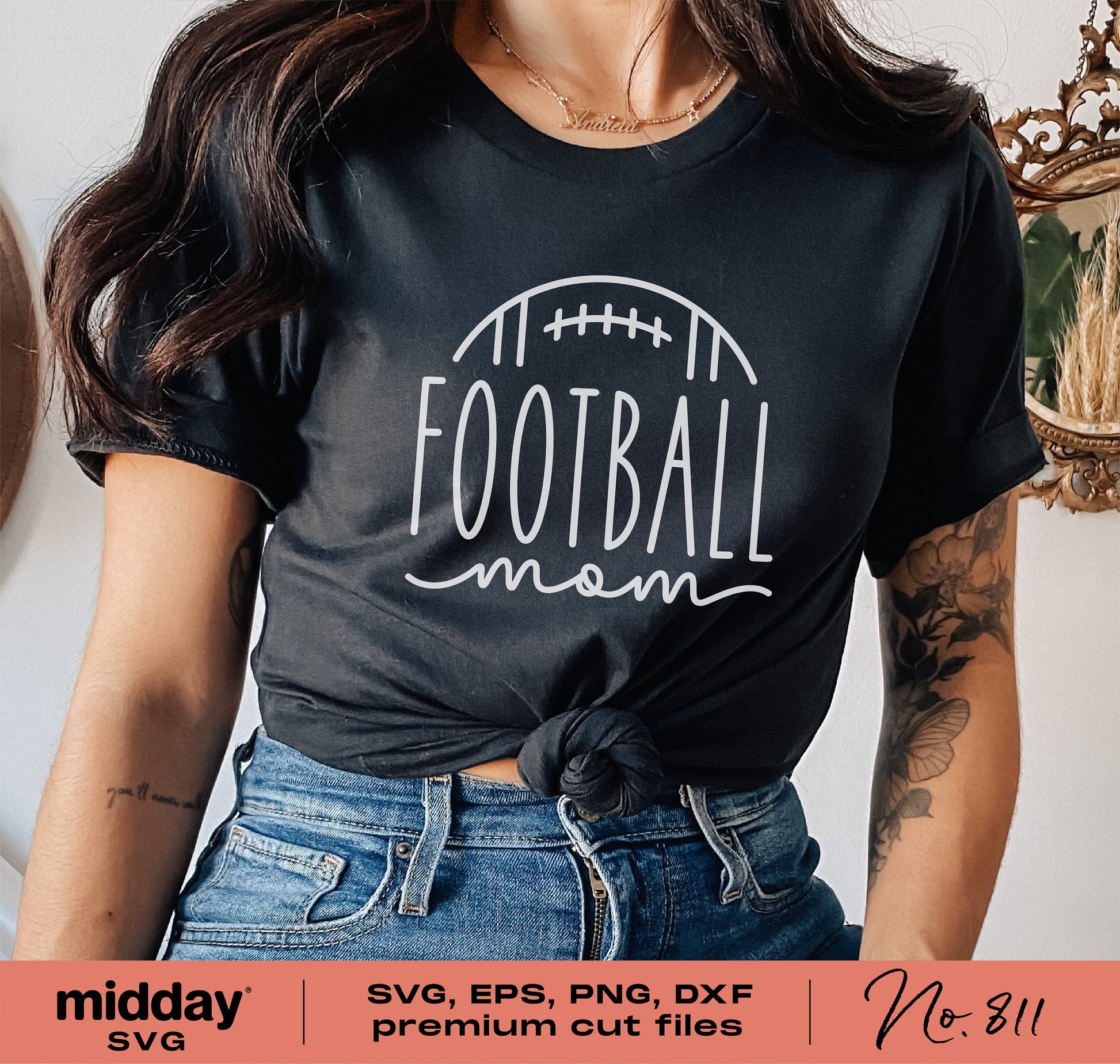 Woman wearing a black t-shirt with 'Football Mom' design, suitable for use with Cricut and Silhouette in SVG, EPS, PNG, DXF formats.