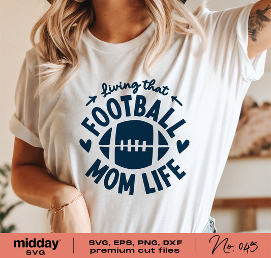 Person wearing 'Living that Football Mom Life' t-shirt, showcasing a football-themed design available as SVG, EPS, PNG, DXF cut files.