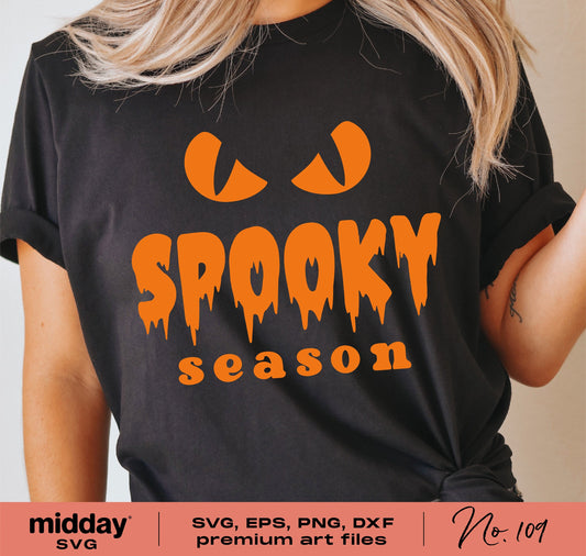 Black t-shirt with "Spooky Season" design in orange, featuring pumpkin eyes graphic, suitable for Cricut and Silhouette projects.