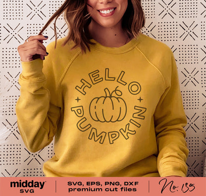 Woman wearing yellow sweatshirt with 'Hello Pumpkin' autumn design, ideal for Cricut and Silhouette cut files, perfect for fall fashion.