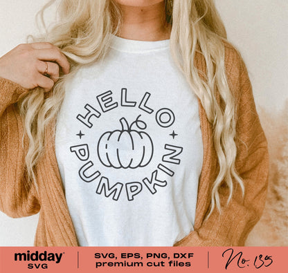 Woman wearing 'Hello Pumpkin' fall shirt design, available as SVG, PNG, DXF, EPS for Cricut and Silhouette, perfect for autumn and Halloween.