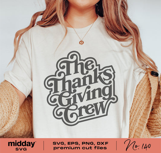 Woman wearing a 'The Thanksgiving Crew' shirt, perfect for family Thanksgiving outfits. Available in SVG, EPS, PNG, DXF formats.