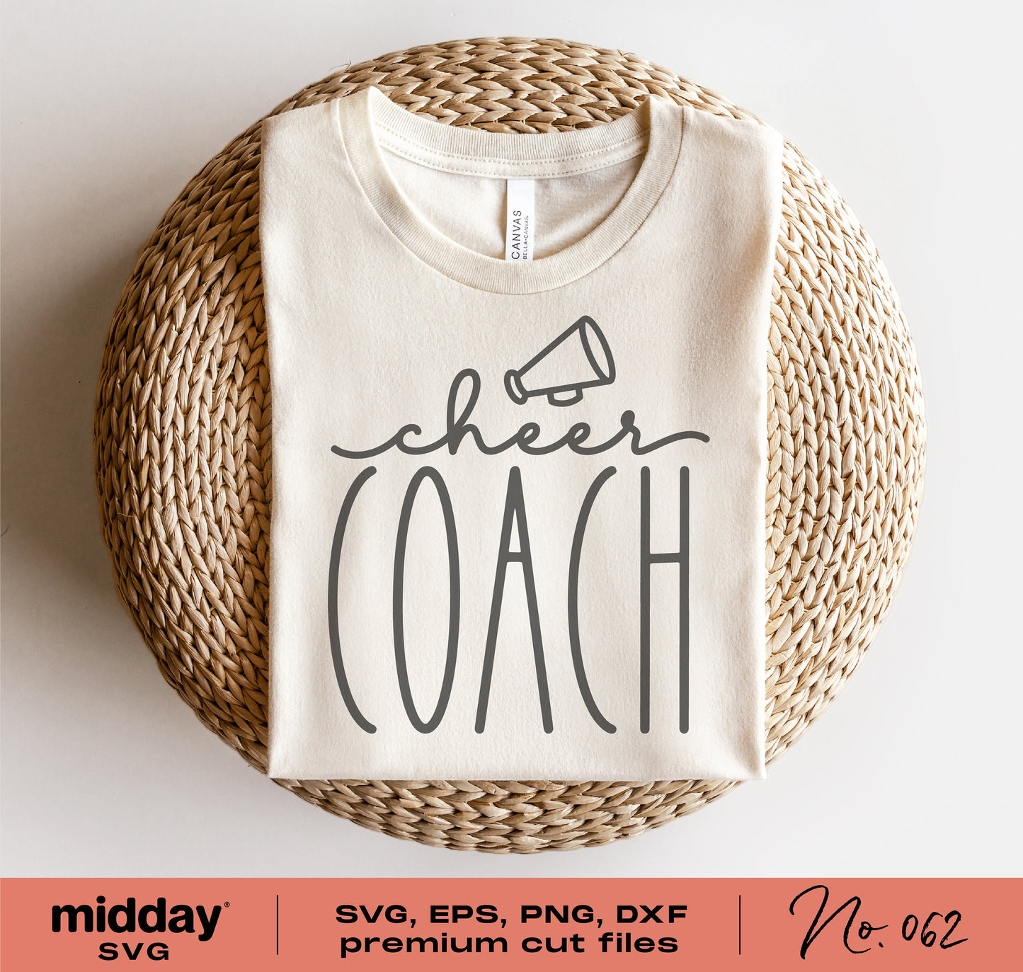 White cheer coach shirt with megaphone design folded on wicker basket, available in SVG, PNG, DXF, EPS formats for Cricut and Silhouette.