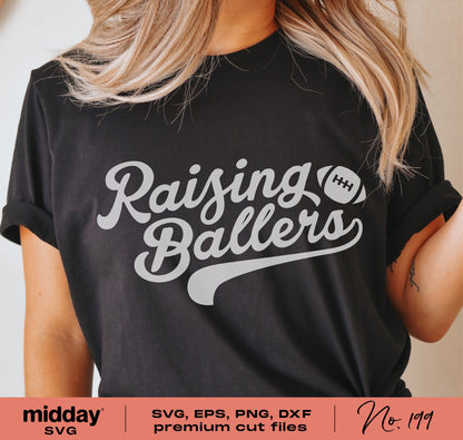 Black T-shirt with 'Raising Ballers' design featuring a football, ideal for football moms and dads, compatible with Cricut and Silhouette.
