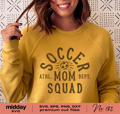Woman wearing yellow sweatshirt with 'Soccer Mom Squad' design for Cricut and Silhouette projects.