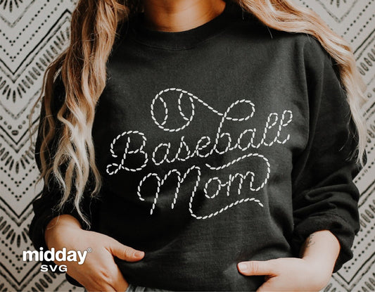 Woman wearing a black sweatshirt with 'Baseball Mom' in white stitched design. Perfect for Cricut and Silhouette crafts.