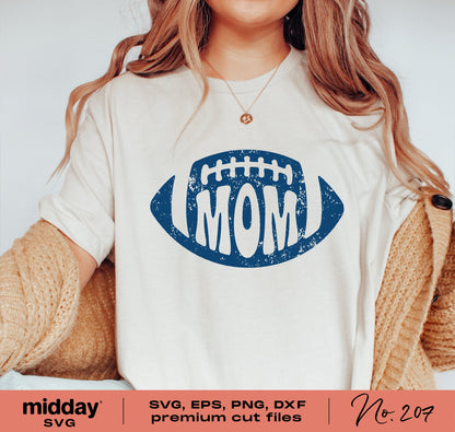 Woman wearing a shirt with a blue football and 'MOM' graphic, showcasing a design for SVG, PNG, DXF, and EPS cut files.