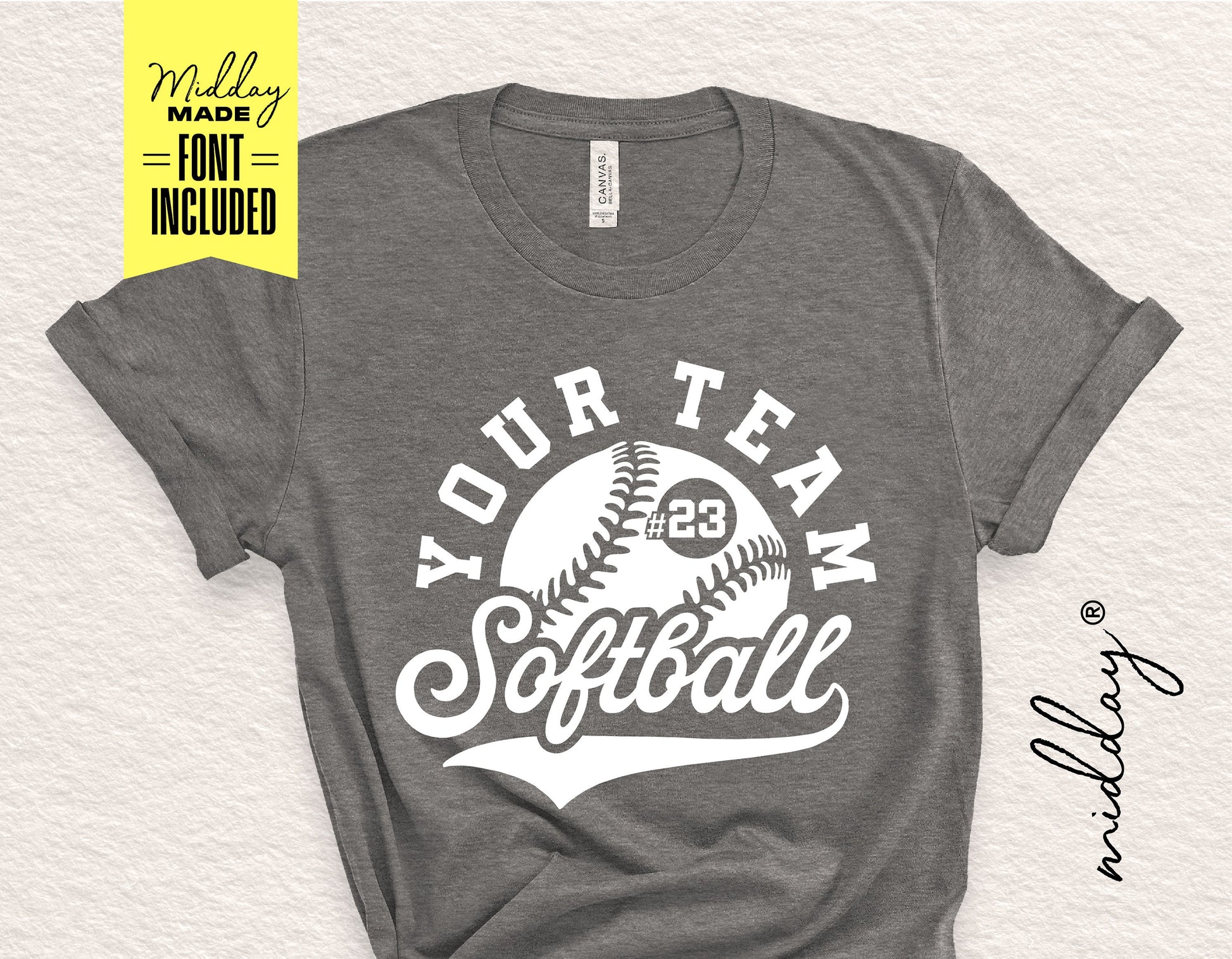 Gray softball shirt with customizable team logo design in white, includes font for personalization, displayed on a flat surface.