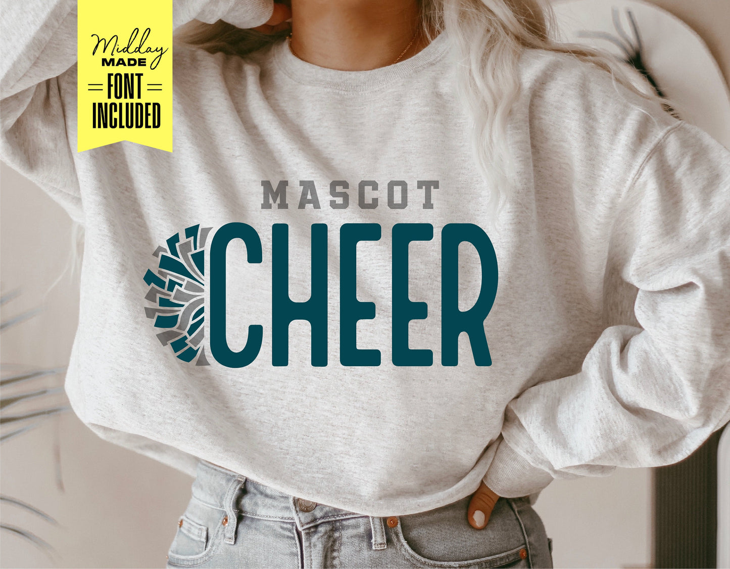 Person wearing sweatshirt with 'Mascot Cheer' logo, featuring pom pom design. Ideal for cheerleader team customization and Cricut projects.