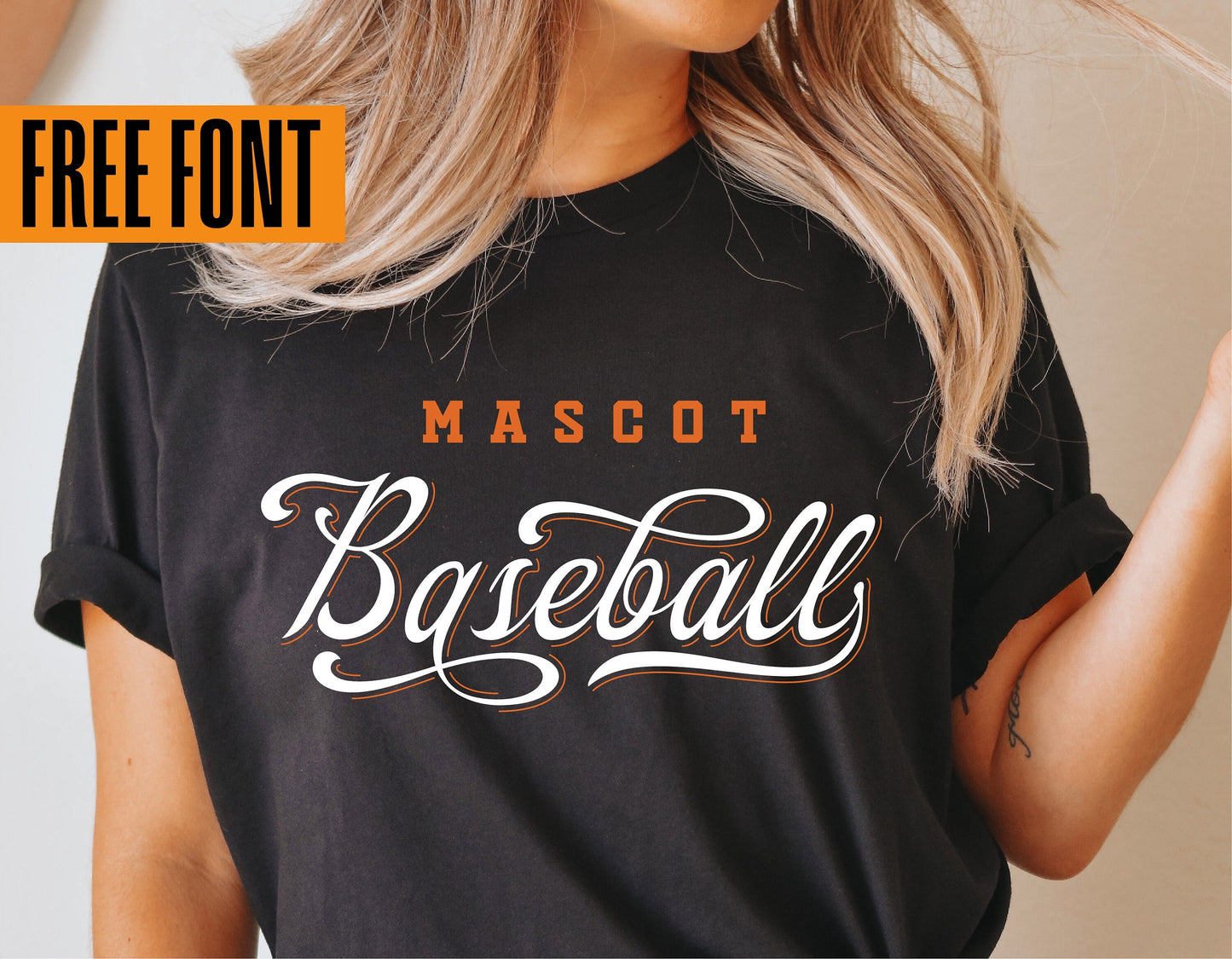 Woman wearing black t-shirt with "Mascot Baseball" vintage script design, showcasing free font offer for Cricut and Silhouette users.