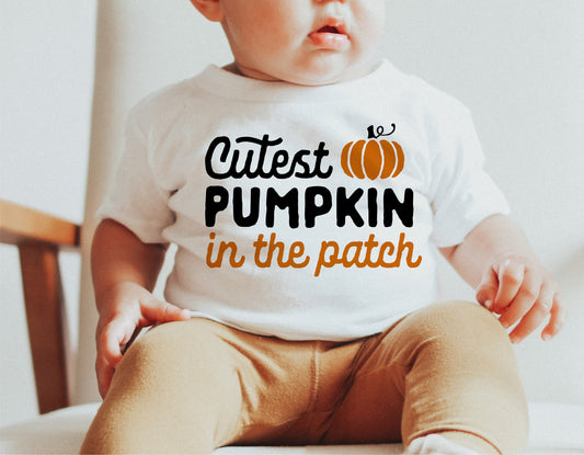 Baby wearing 'Cutest Pumpkin in the Patch' shirt, perfect for baby's first Halloween, fall fashion, and autumn SVG designs.