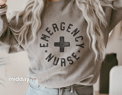 Woman wearing a gray sweatshirt with 'Emergency Nurse' text and a medical cross graphic.