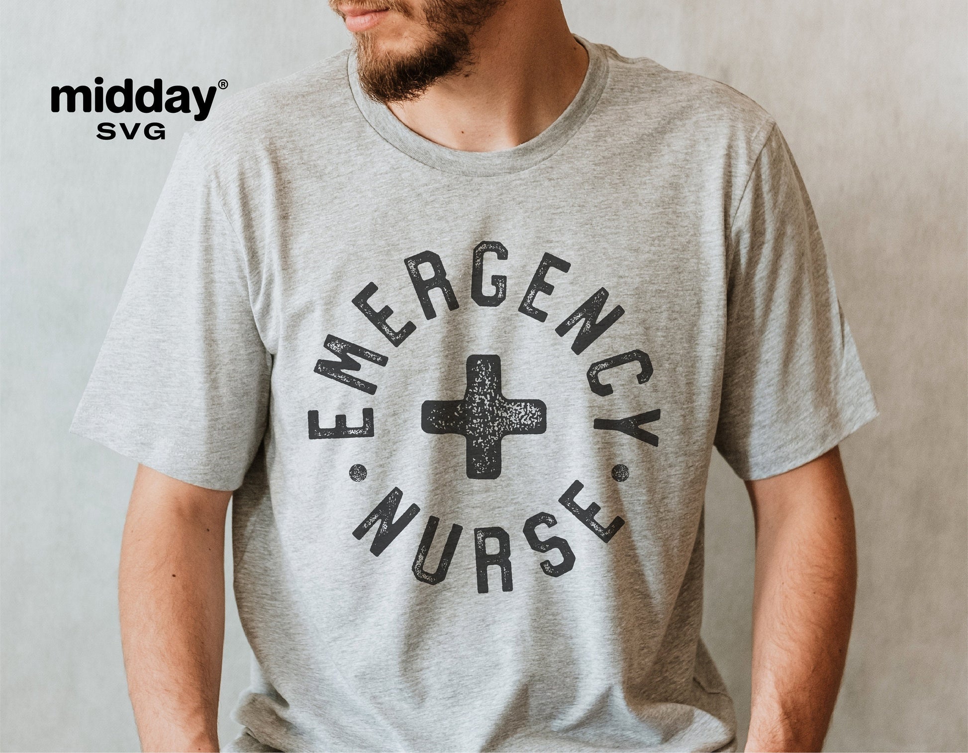 Gray shirt with 'Emergency Nurse' text and medical cross design, perfect for ER nurse apparel and Cricut cut file projects.