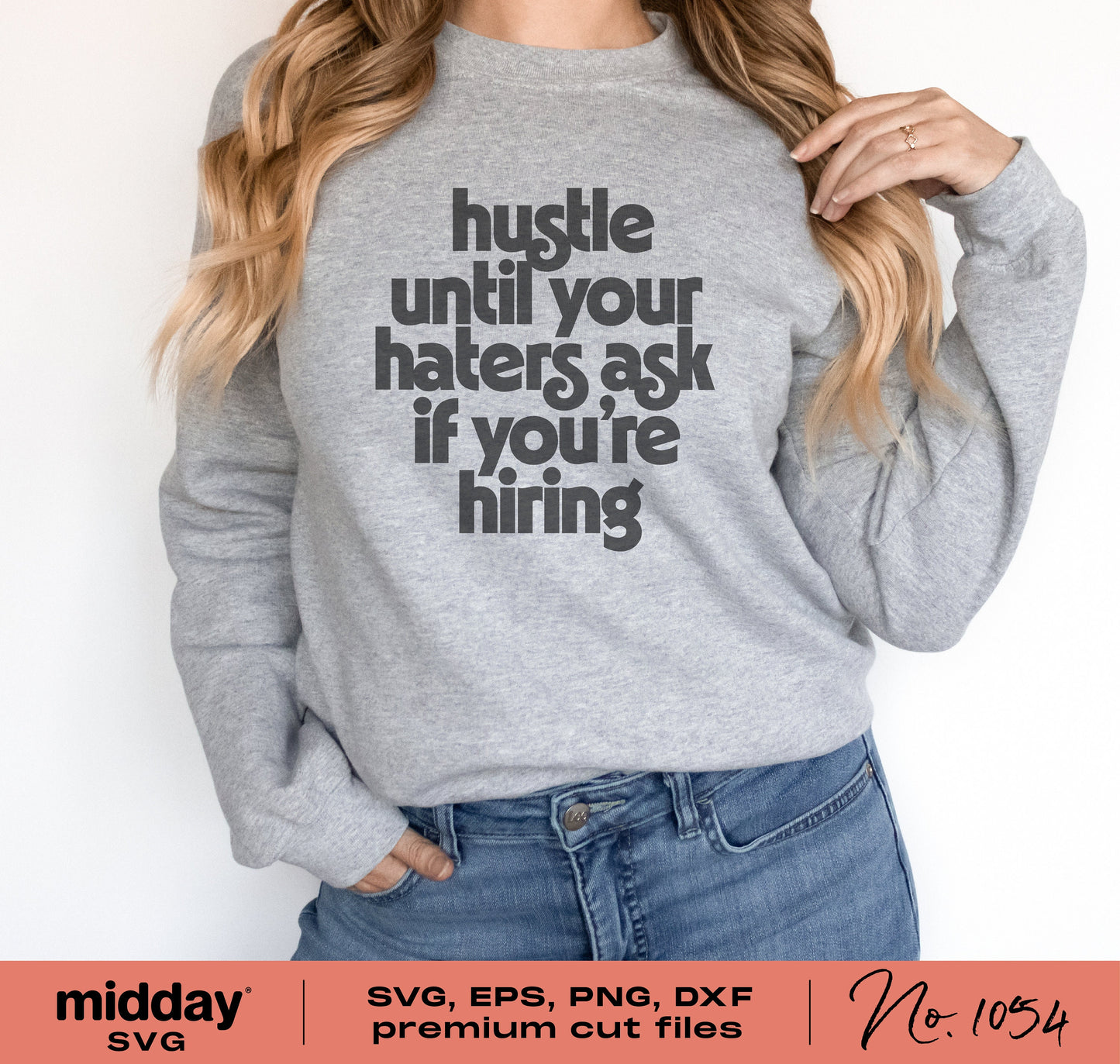 Woman wearing a gray sweatshirt with the text 'Hustle Until Your Haters Ask If You're Hiring' designed for Cricut and Silhouette use.