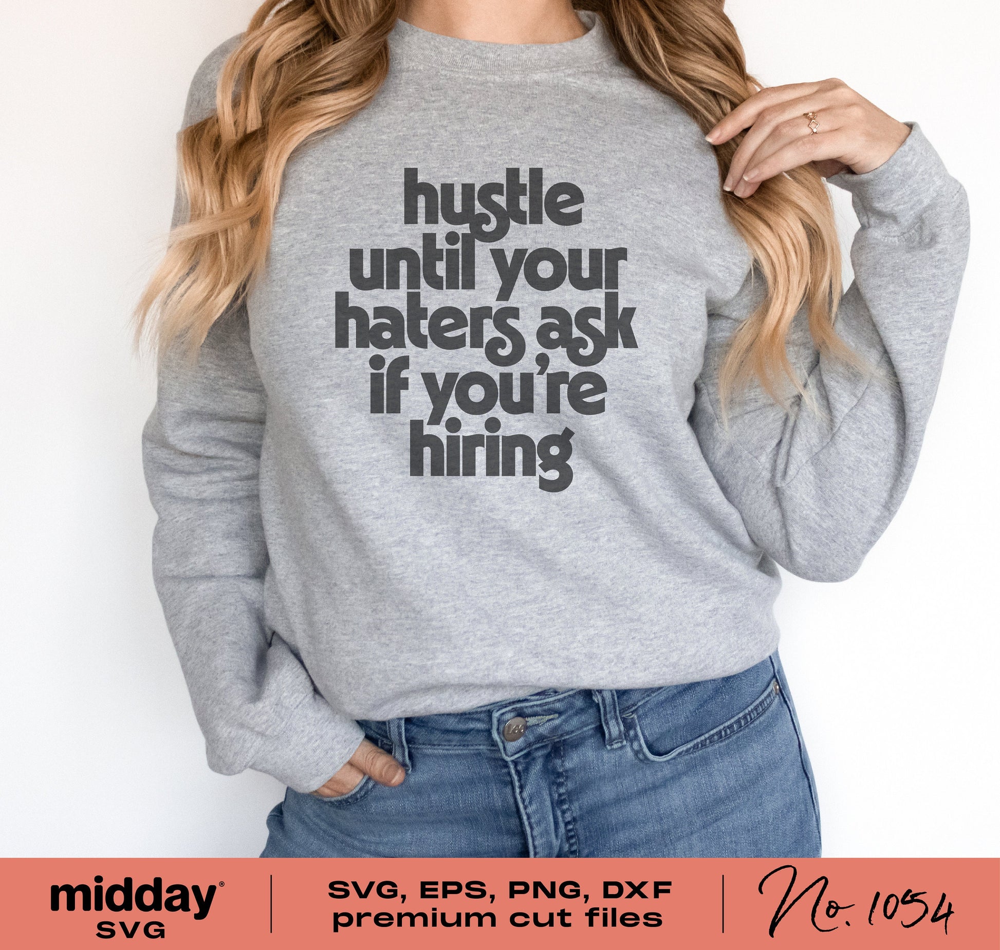 Woman wearing a gray sweatshirt with the text 'Hustle Until Your Haters Ask If You're Hiring' designed for Cricut and Silhouette use.
