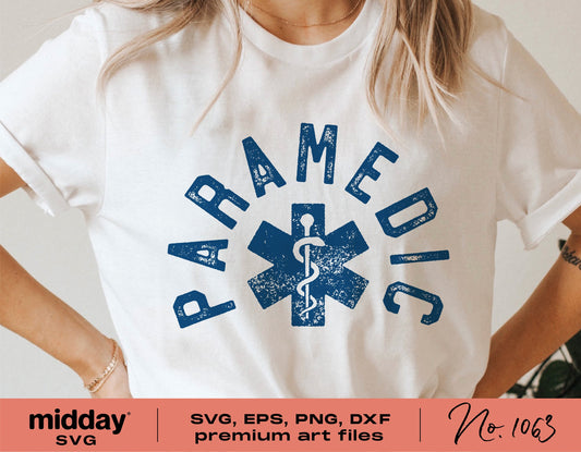 White t-shirt with a blue paramedic design, featuring text and a star of life symbol. Includes SVG, EPS, PNG, and DXF files for crafting.