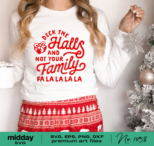 Woman wearing a funny Christmas shirt with 'Deck the Halls and Not Your Family' design, perfect for Cricut and Silhouette projects.