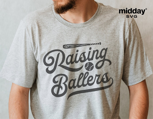 Person wearing a gray t-shirt with 'Raising Ballers' baseball-themed design, perfect for baseball moms or dads, SVG file available for Cricut.