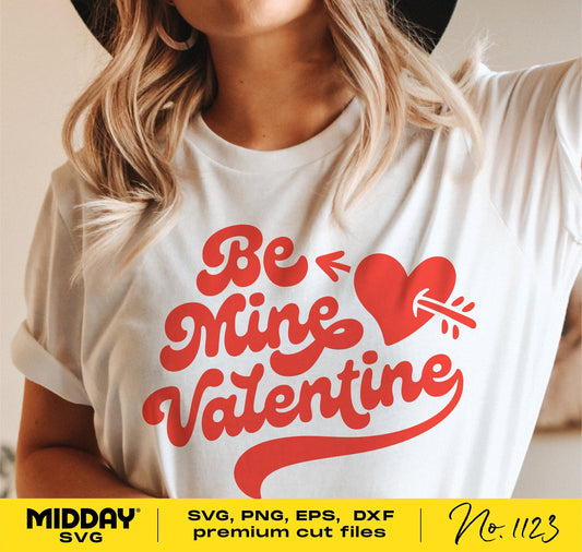 Woman wearing Valentine's Day shirt with 'Be Mine Valentine' design featuring heart and arrow, suitable for Cricut and Silhouette.