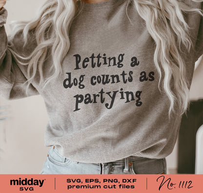 Person wearing a gray shirt with 'Petting a dog counts as partying' text, ideal for dog lovers and crafting with Cricut and Silhouette.