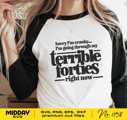 Woman wearing a shirt with 'Sorry I'm cranky... I'm going through my terrible forties right now' text, promoting premium cut files for Cricut.