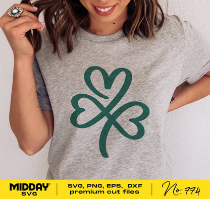 Woman wearing gray shirt with green shamrock design, St. Patrick's Day SVG file, suited for Cricut and Silhouette projects.