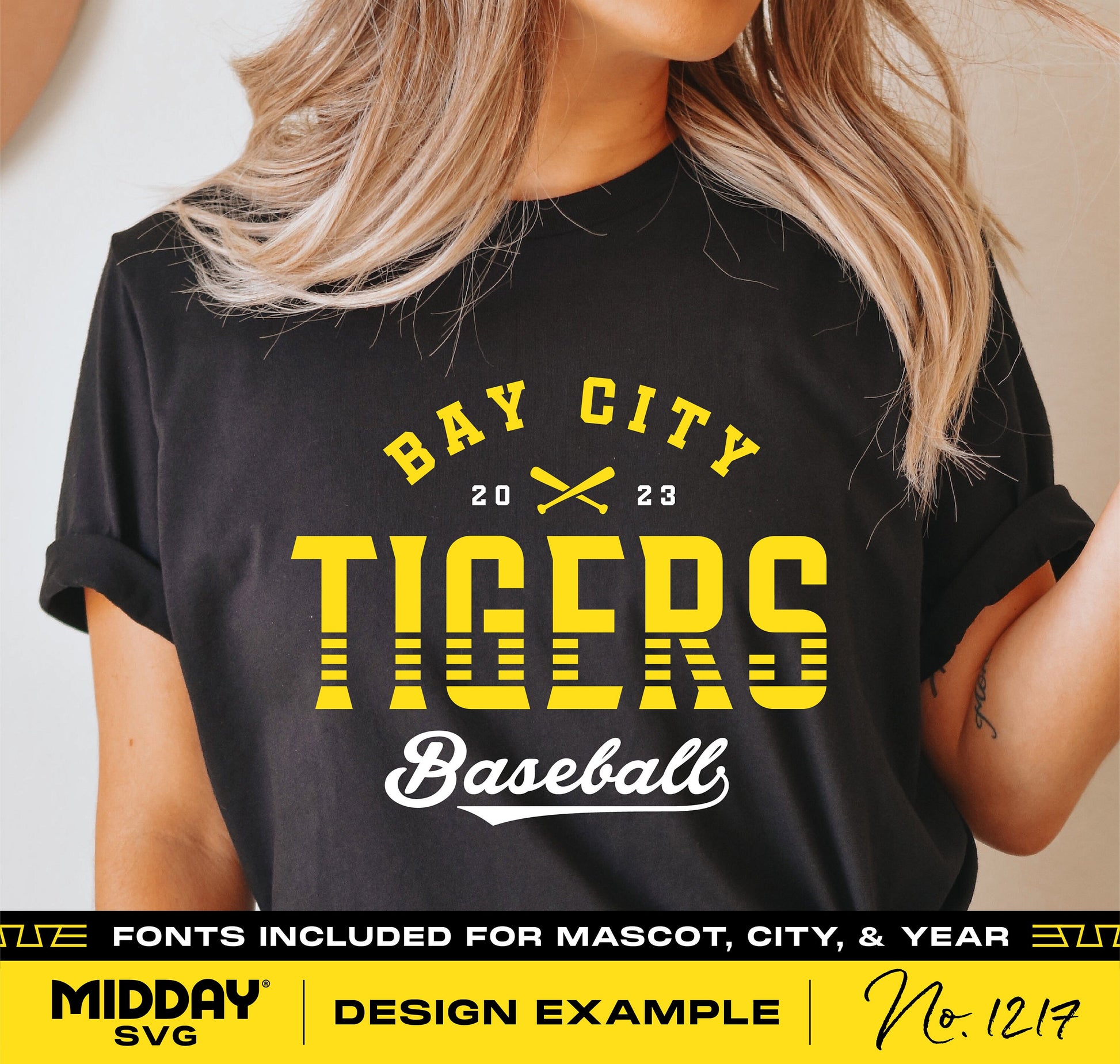Woman wearing a black t-shirt with Bay City Tigers 2023 baseball logo design, featuring fonts for mascot, city, and year.