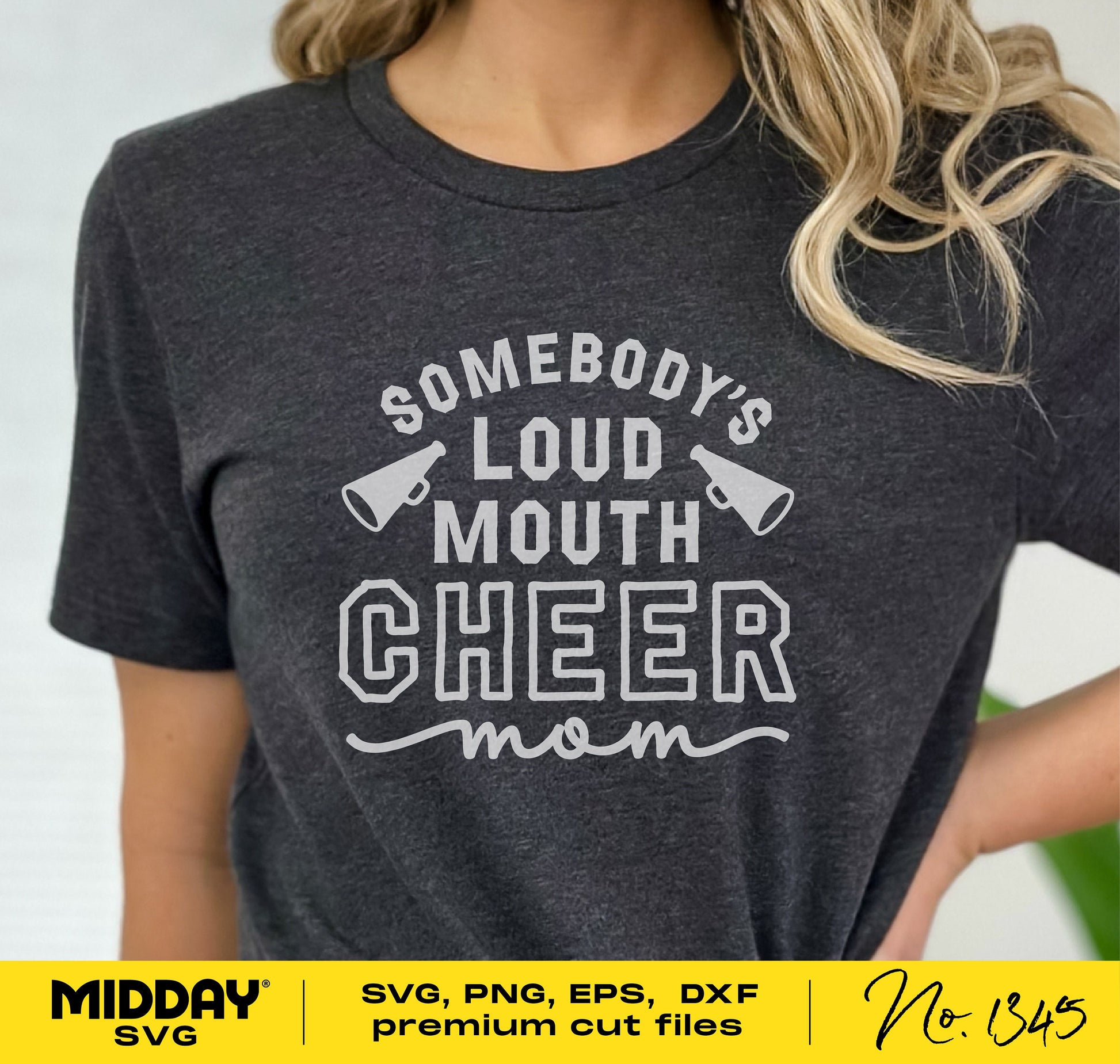 Woman wearing a black t-shirt with 'Somebody's Loud Mouth Cheer Mom' graphic design for cheer mom SVG cut file.
