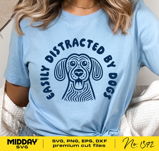 Woman wearing a blue shirt with "Easily Distracted by Dogs" SVG design, perfect for Cricut, shirts, and tumblers.