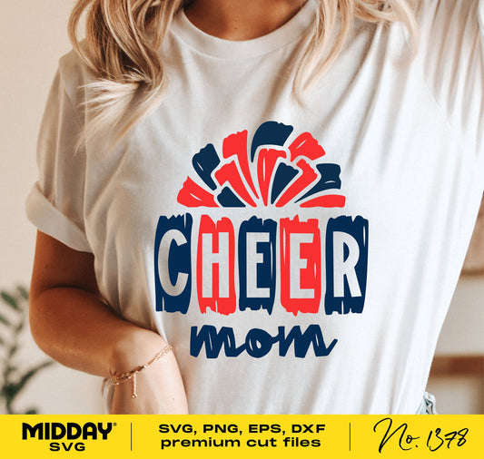 Woman wearing a t-shirt with hand drawn 'Cheer Mom' design in red and blue; featuring pom poms. Suitable for Cricut and Silhouette crafting.