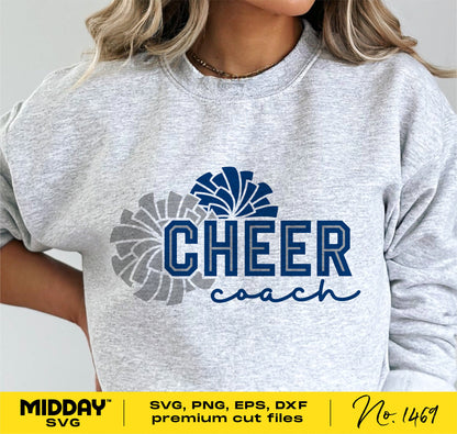 Woman wearing grey sweatshirt with 'Cheer Coach' design, featuring pom poms, for cheerleading enthusiasts or coaches.