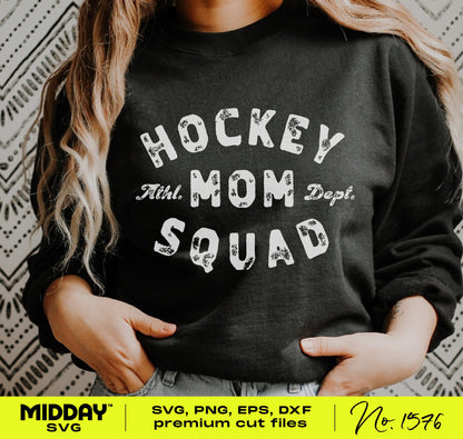 Woman wearing a black sweatshirt with 'Hockey Mom Squad' design in bold typography.
